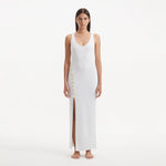 Raine White Knit Maxi Dress with Side Slit & Button Detail | Moeva | RTW Dresses | Each week unveils new pieces—luxury swimwear, fluid resort silhouettes, and elevated summer-to-evening essentials designed to carry you from coastal escapes to city nights.