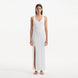 Raine White Knit Maxi Dress with Side Slit & Button Detail | Moeva | RTW Dresses | Each week unveils new pieces—luxury swimwear, fluid resort silhouettes, and elevated summer-to-evening essentials designed to carry you from coastal escapes to city nights.