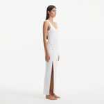 Raine White Knit Maxi Dress with Side Slit & Button Detail | Moeva | RTW Dresses | Each week unveils new pieces—luxury swimwear, fluid resort silhouettes, and elevated summer-to-evening essentials designed to carry you from coastal escapes to city nights.