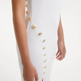 Raine White Knit Maxi Dress with Side Slit & Button Detail | Moeva | RTW Dresses | Each week unveils new pieces—luxury swimwear, fluid resort silhouettes, and elevated summer-to-evening essentials designed to carry you from coastal escapes to city nights.
