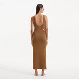 Raine Brown Knit Maxi Dress with Side Slit & Button Detail | Moeva | RTW Dresses | Each week unveils new pieces—luxury swimwear, fluid resort silhouettes, and elevated summer-to-evening essentials designed to carry you from coastal escapes to city nights.