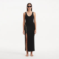 Raine Black Knit Maxi Dress with Side Slit & Button Detail | Moeva | Dress | Each week unveils new pieces—luxury swimwear, fluid resort silhouettes, and elevated summer-to-evening essentials designed to carry you from coastal escapes to city nights.