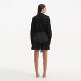 Nayeli Black Tie-Front Cotton Shirt Dress | Moeva | Beachwear Dresses | Each week unveils new pieces—luxury swimwear, fluid resort silhouettes, and elevated summer-to-evening essentials designed to carry you from coastal escapes to city nights.