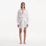 Nayeli White Tie-Front Cotton Shirt Dress | Moeva | Beachwear Dresses | Each week unveils new pieces—luxury swimwear, fluid resort silhouettes, and elevated summer-to-evening essentials designed to carry you from coastal escapes to city nights.
