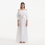Dante White Off-Shoulder Maxi Dress with Belted Waist | Moeva | RTW Dresses | Each week unveils new pieces—luxury swimwear, fluid resort silhouettes, and elevated summer-to-evening essentials designed to carry you from coastal escapes to city nights.