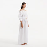 Dante White Off-Shoulder Maxi Dress with Belted Waist | Moeva | RTW Dresses | Each week unveils new pieces—luxury swimwear, fluid resort silhouettes, and elevated summer-to-evening essentials designed to carry you from coastal escapes to city nights.