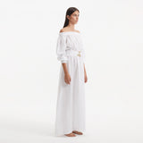 Dante White Off-Shoulder Maxi Dress with Belted Waist | Moeva | RTW Dresses | Each week unveils new pieces—luxury swimwear, fluid resort silhouettes, and elevated summer-to-evening essentials designed to carry you from coastal escapes to city nights.