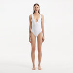 Breena White V Neck Swimsuit | Moeva | Swimsuit | Each week unveils new pieces—luxury swimwear, fluid resort silhouettes, and elevated summer-to-evening essentials designed to carry you from coastal escapes to city nights.