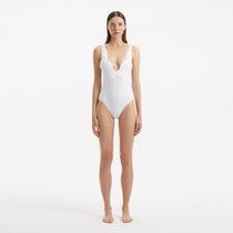 Breena White V Neck Swimsuit | Moeva | Swimsuit | Each week unveils new pieces—luxury swimwear, fluid resort silhouettes, and elevated summer-to-evening essentials designed to carry you from coastal escapes to city nights.