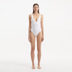 Breena White V Neck Swimsuit | Moeva | Swimsuit | Each week unveils new pieces—luxury swimwear, fluid resort silhouettes, and elevated summer-to-evening essentials designed to carry you from coastal escapes to city nights.