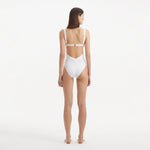 Breena White V Neck Swimsuit | Moeva | Swimsuit | Each week unveils new pieces—luxury swimwear, fluid resort silhouettes, and elevated summer-to-evening essentials designed to carry you from coastal escapes to city nights.