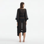 Opal Black Sheer Gold Buttoned Belted Kaftan | Moeva | Kaftan | Each week unveils new pieces—luxury swimwear, fluid resort silhouettes, and elevated summer-to-evening essentials designed to carry you from coastal escapes to city nights.