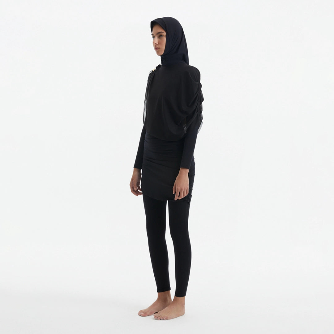 Risha Black Swim Hijab | Moeva | Women Hair Accessories | Each week unveils new pieces—luxury swimwear, fluid resort silhouettes, and elevated summer-to-evening essentials designed to carry you from coastal escapes to city nights.