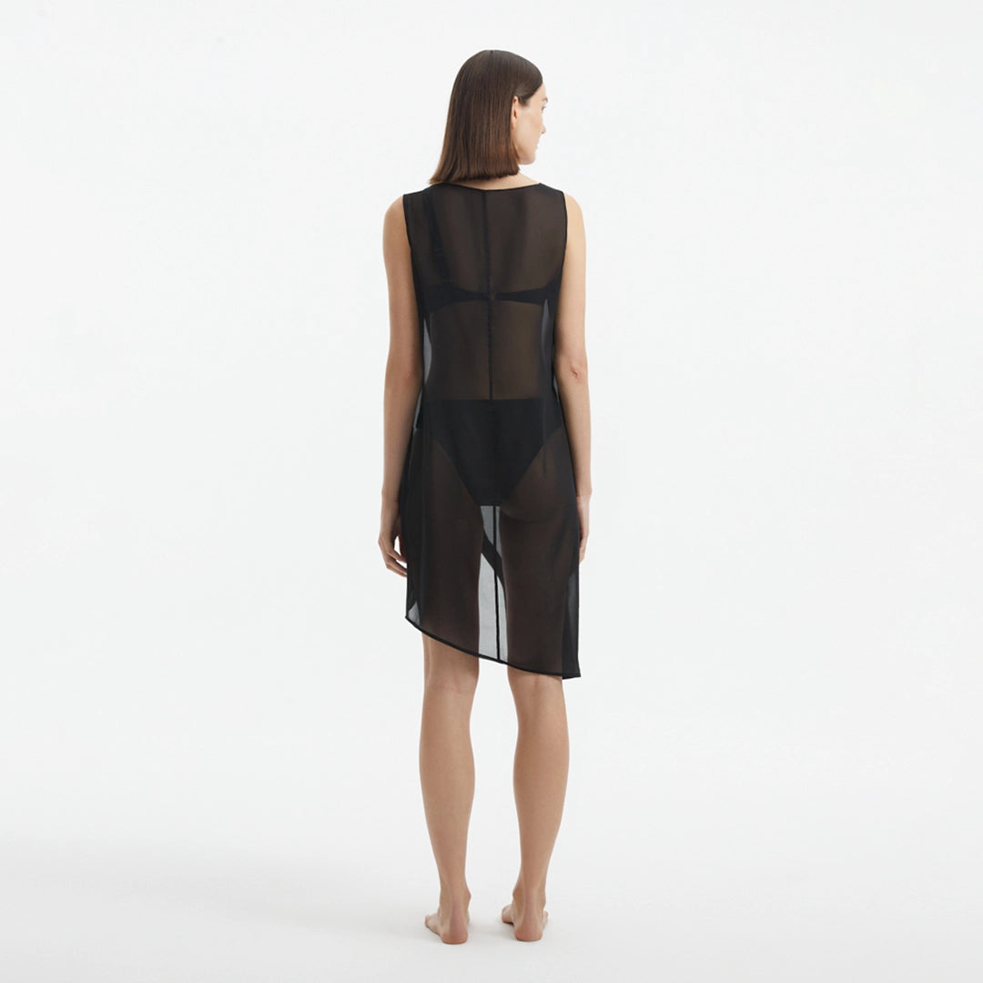 Adora Black Sheer Sleeveless Asymmetric Dress with Gold Button Detail | Moeva | Dress | Each week unveils new pieces—luxury swimwear, fluid resort silhouettes, and elevated summer-to-evening essentials designed to carry you from coastal escapes to city nights.