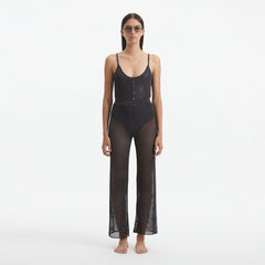 Luz Silver Metallic Sheer Knit Pants | Moeva | Women Beachwear Pants | Each week unveils new pieces—luxury swimwear, fluid resort silhouettes, and elevated summer-to-evening essentials designed to carry you from coastal escapes to city nights.