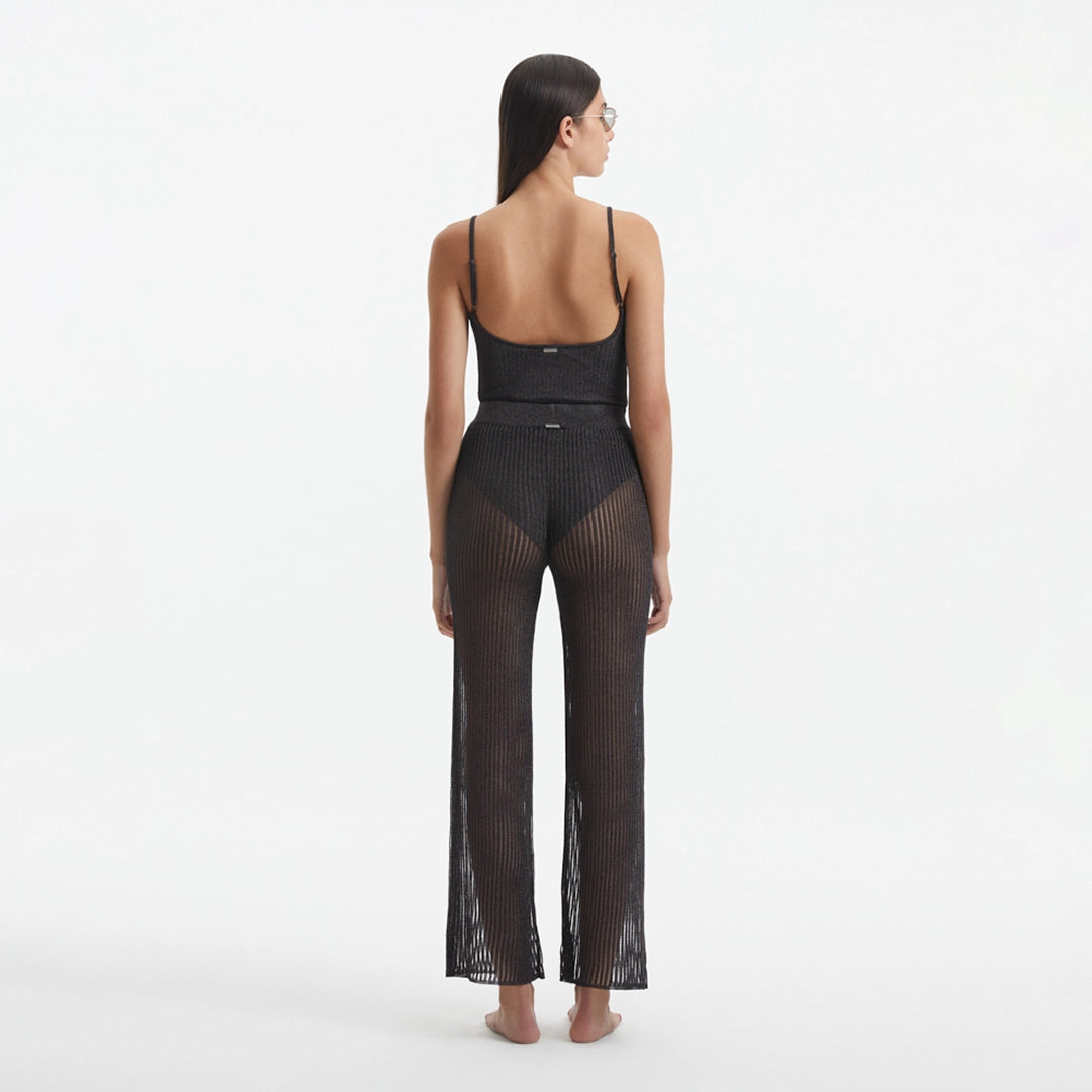 Luz Silver Metallic Sheer Knit Pants | Moeva | Women Beachwear Pants | Each week unveils new pieces—luxury swimwear, fluid resort silhouettes, and elevated summer-to-evening essentials designed to carry you from coastal escapes to city nights.