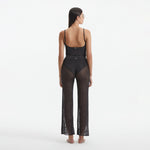 Luz Silver Metallic Sheer Knit Pants | Moeva | Women Beachwear Pants | Each week unveils new pieces—luxury swimwear, fluid resort silhouettes, and elevated summer-to-evening essentials designed to carry you from coastal escapes to city nights.