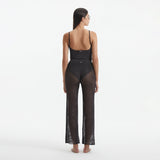 Luz Silver Metallic Sheer Knit Pants | Moeva | Women Beachwear Pants | Each week unveils new pieces—luxury swimwear, fluid resort silhouettes, and elevated summer-to-evening essentials designed to carry you from coastal escapes to city nights.
