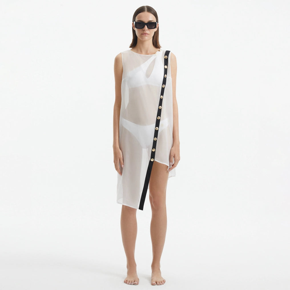 Adora White Sheer Sleeveless Asymmetric Dress with Gold Button Detail | Moeva | Dress | Each week unveils new pieces—luxury swimwear, fluid resort silhouettes, and elevated summer-to-evening essentials designed to carry you from coastal escapes to city nights.