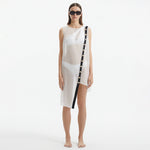Adora White Sheer Sleeveless Asymmetric Dress with Gold Button Detail | Moeva | Dress | Each week unveils new pieces—luxury swimwear, fluid resort silhouettes, and elevated summer-to-evening essentials designed to carry you from coastal escapes to city nights.