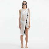 Adora White Sheer Sleeveless Asymmetric Dress with Gold Button Detail | Moeva | Dress | Each week unveils new pieces—luxury swimwear, fluid resort silhouettes, and elevated summer-to-evening essentials designed to carry you from coastal escapes to city nights.