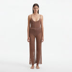 Luz Brown Metallic Sheer Knit Pants | Moeva | Women Beachwear Pants | Each week unveils new pieces—luxury swimwear, fluid resort silhouettes, and elevated summer-to-evening essentials designed to carry you from coastal escapes to city nights.