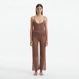 Luz Brown Metallic Sheer Knit Pants | Moeva | Women Beachwear Pants | Each week unveils new pieces—luxury swimwear, fluid resort silhouettes, and elevated summer-to-evening essentials designed to carry you from coastal escapes to city nights.