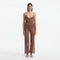 Luz Brown Metallic Sheer Knit Pants | Moeva | Women Beachwear Pants | Each week unveils new pieces—luxury swimwear, fluid resort silhouettes, and elevated summer-to-evening essentials designed to carry you from coastal escapes to city nights.