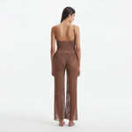 Luz Brown Metallic Sheer Knit Pants | Moeva | Women Beachwear Pants | Each week unveils new pieces—luxury swimwear, fluid resort silhouettes, and elevated summer-to-evening essentials designed to carry you from coastal escapes to city nights.