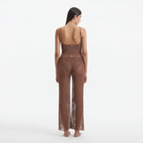 Luz Brown Metallic Sheer Knit Pants | Moeva | Women Beachwear Pants | Each week unveils new pieces—luxury swimwear, fluid resort silhouettes, and elevated summer-to-evening essentials designed to carry you from coastal escapes to city nights.