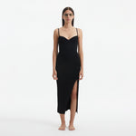Beau Black Sleeveless Knitted Long Dress with Side Slit | Moeva | RTW Dresses | Each week unveils new pieces—luxury swimwear, fluid resort silhouettes, and elevated summer-to-evening essentials designed to carry you from coastal escapes to city nights.