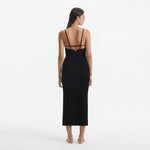 Beau Black Sleeveless Knitted Long Dress with Side Slit | Moeva | RTW Dresses | Each week unveils new pieces—luxury swimwear, fluid resort silhouettes, and elevated summer-to-evening essentials designed to carry you from coastal escapes to city nights.