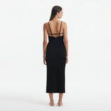 Beau Black Sleeveless Knitted Long Dress with Side Slit | Moeva | RTW Dresses | Each week unveils new pieces—luxury swimwear, fluid resort silhouettes, and elevated summer-to-evening essentials designed to carry you from coastal escapes to city nights.