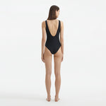 Naida Black V Neck Textured Swimsuit | Moeva | Swimsuit | Each week unveils new pieces—luxury swimwear, fluid resort silhouettes, and elevated summer-to-evening essentials designed to carry you from coastal escapes to city nights.