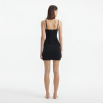 Osaka Black Corset Mini Dress with Wrap Skirt | Moeva | RTW Dresses | Each week unveils new pieces—luxury swimwear, fluid resort silhouettes, and elevated summer-to-evening essentials designed to carry you from coastal escapes to city nights.