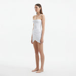 Osaka White Corset Mini Dress with Wrap Skirt | Moeva | RTW Dresses | Each week unveils new pieces—luxury swimwear, fluid resort silhouettes, and elevated summer-to-evening essentials designed to carry you from coastal escapes to city nights.