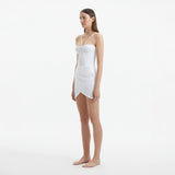 Osaka White Corset Mini Dress with Wrap Skirt | Moeva | RTW Dresses | Each week unveils new pieces—luxury swimwear, fluid resort silhouettes, and elevated summer-to-evening essentials designed to carry you from coastal escapes to city nights.