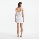 Osaka White Corset Mini Dress with Wrap Skirt | Moeva | RTW Dresses | Each week unveils new pieces—luxury swimwear, fluid resort silhouettes, and elevated summer-to-evening essentials designed to carry you from coastal escapes to city nights.