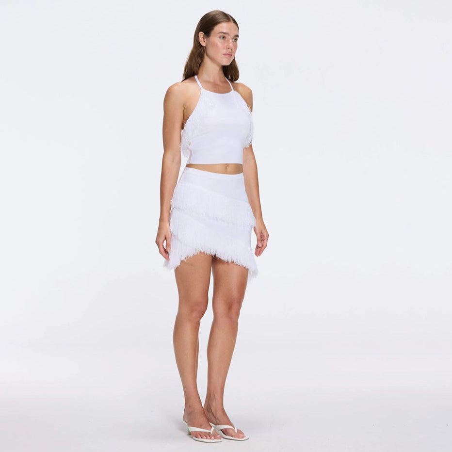 Nebula White Fringe Detail Halter Knit Top | Moeva | RTW Bustiers | Each week unveils new pieces—luxury swimwear, fluid resort silhouettes, and elevated summer-to-evening essentials designed to carry you from coastal escapes to city nights.