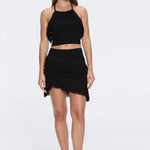Nebula And Arlo Fringe Asymmetric Black Knit Set | Moeva | | Each week unveils new pieces—luxury swimwear, fluid resort silhouettes, and elevated summer-to-evening essentials designed to carry you from coastal escapes to city nights.
