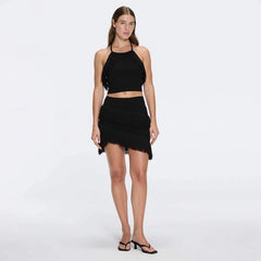 Arlo Black Fringe Detail Asymmetric Mini Skirt | Moeva | RTW Skirts | Each week unveils new pieces—luxury swimwear, fluid resort silhouettes, and elevated summer-to-evening essentials designed to carry you from coastal escapes to city nights.