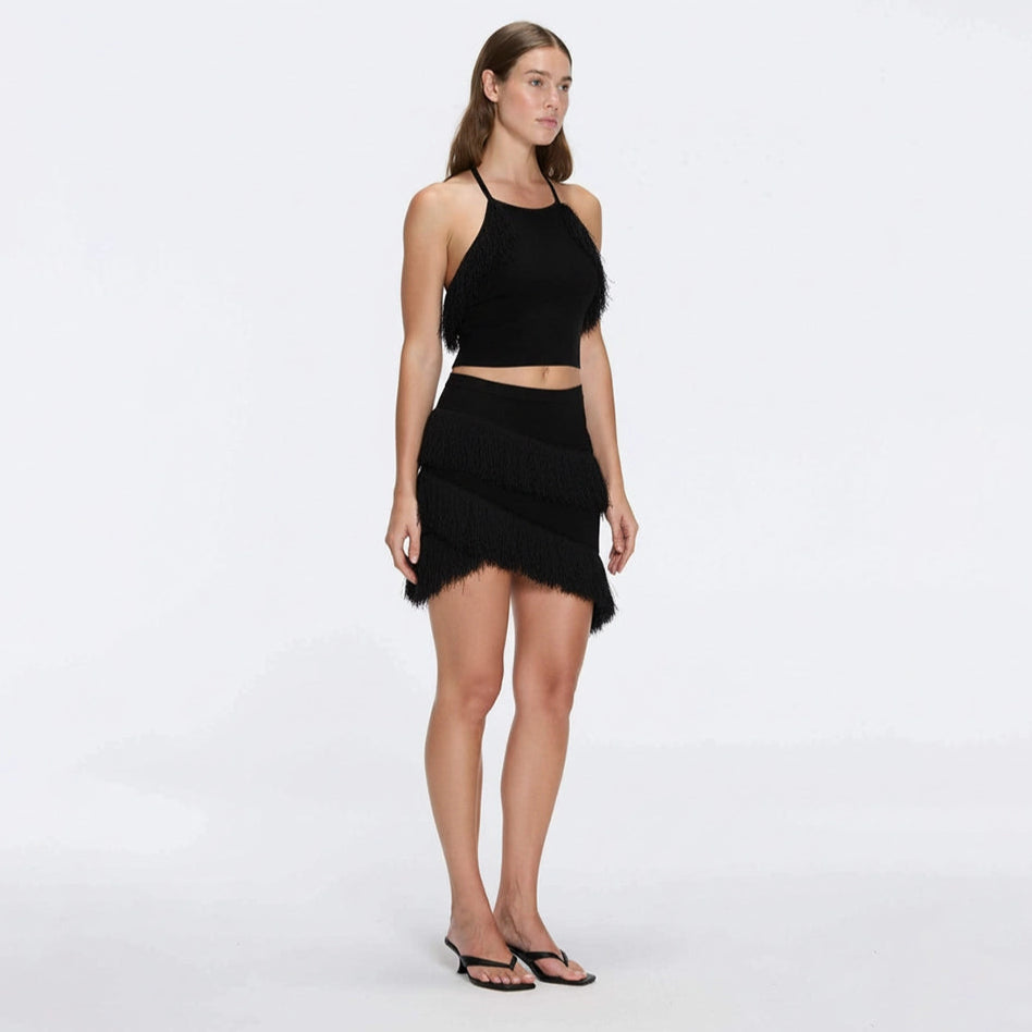 Nebula Black Fringe Detail Halter Knit Top | Moeva | RTW Bustiers | Each week unveils new pieces—luxury swimwear, fluid resort silhouettes, and elevated summer-to-evening essentials designed to carry you from coastal escapes to city nights.