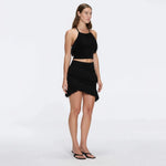 Nebula Black Fringe Detail Halter Knit Top | Moeva | RTW Bustiers | Each week unveils new pieces—luxury swimwear, fluid resort silhouettes, and elevated summer-to-evening essentials designed to carry you from coastal escapes to city nights.