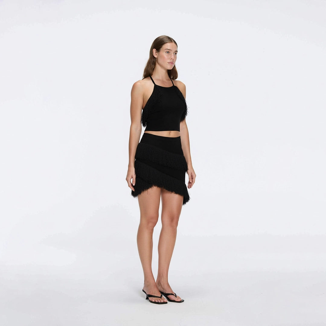 Arlo Black Fringe Detail Asymmetric Mini Skirt | Moeva | Skirt | Each week unveils new pieces—luxury swimwear, fluid resort silhouettes, and elevated summer-to-evening essentials designed to carry you from coastal escapes to city nights.