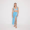 Pina Blue/White Asymmetric Gold Button Maxi Skirt | Moeva | Beachwear Skirts | Each week unveils new pieces—luxury swimwear, fluid resort silhouettes, and elevated summer-to-evening essentials designed to carry you from coastal escapes to city nights.