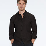 Man wearing a black shirt and pants on a white background
