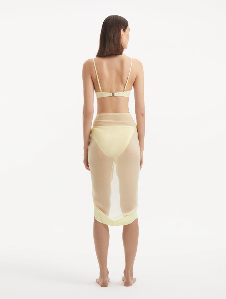 "Back view of the Raiden Yellow Pareo, illustrating the elegant drape and vibrant yellow hue."