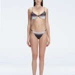 Front view of model wearing Rory Black Optical Bikini Set with halterneck design and underwire support.
