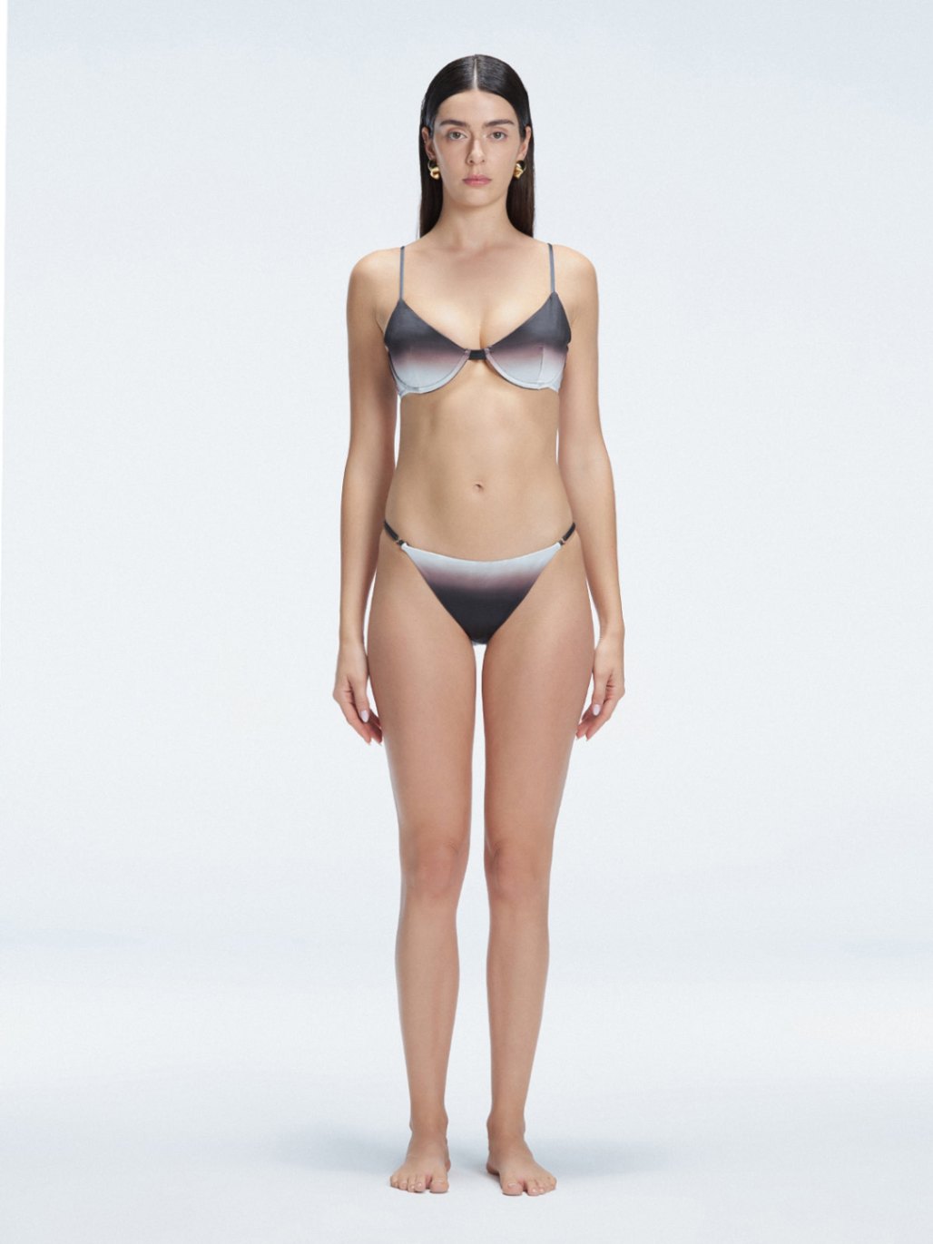 Front view of model wearing Rory Black Optical Bikini Set with halterneck design and underwire support.
