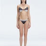 Front view of model wearing Rory Black Optical Bikini Set with halterneck design and underwire support.
